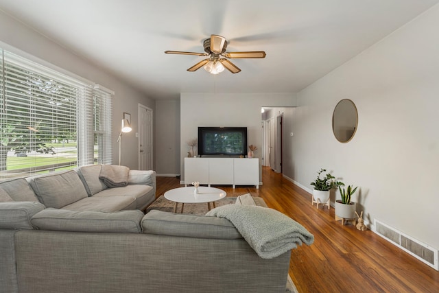 living room with hardwood / wood-style floors and ceiling fan