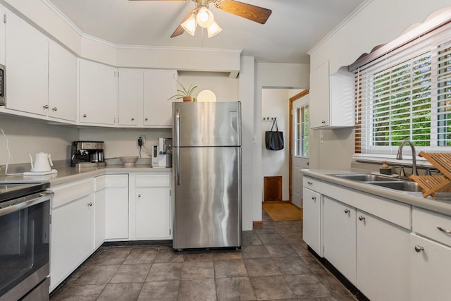 kitchen with white cabinetry, sink, ceiling fan, crown molding, and appliances with stainless steel finishes