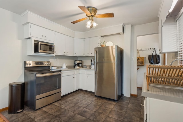 kitchen featuring stainless steel appliances, white cabinetry, and ceiling fan