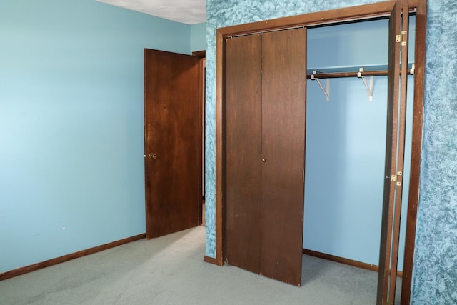 unfurnished bedroom featuring light colored carpet