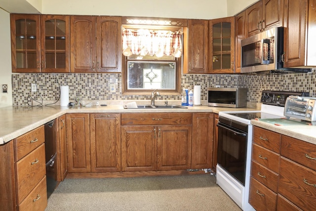 kitchen with decorative backsplash, white electric range, and sink