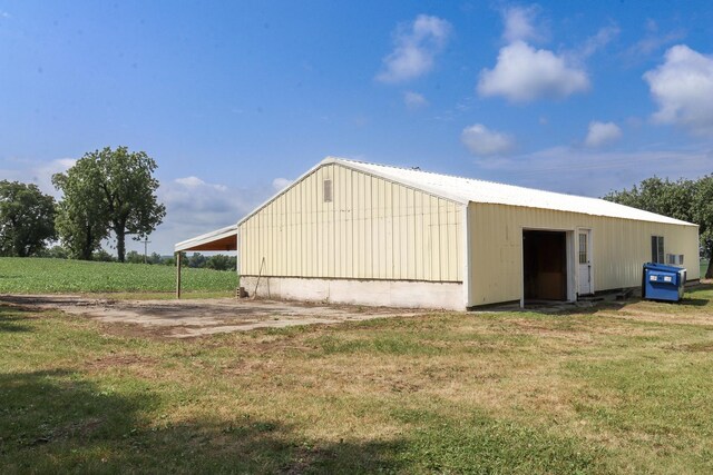 view of outbuilding with a lawn