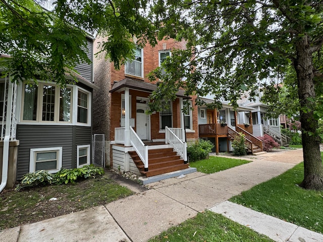 view of property with brick siding