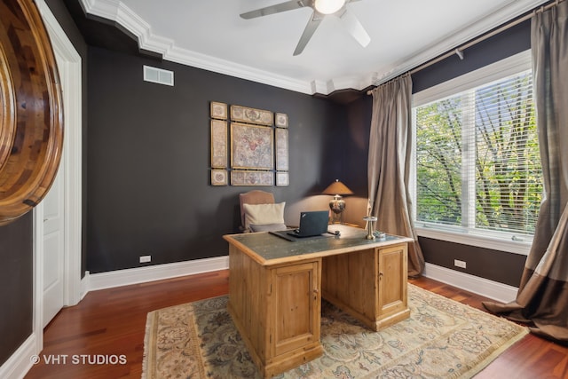 office space with a healthy amount of sunlight, crown molding, and dark hardwood / wood-style flooring