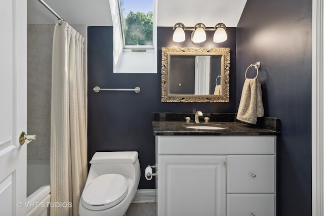 full bathroom with vanity, toilet, and shower / bath combo