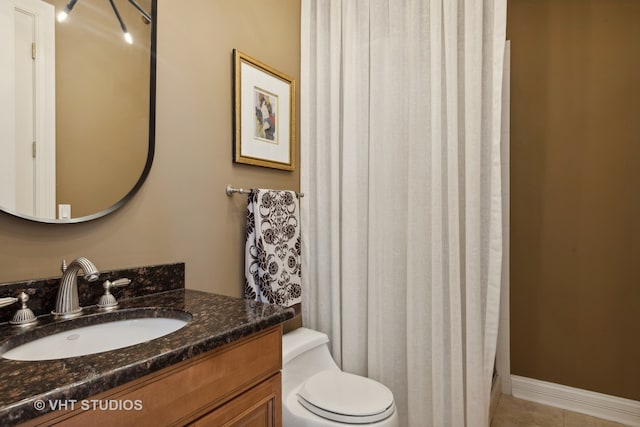 bathroom with tile patterned flooring, a shower with curtain, vanity, and toilet