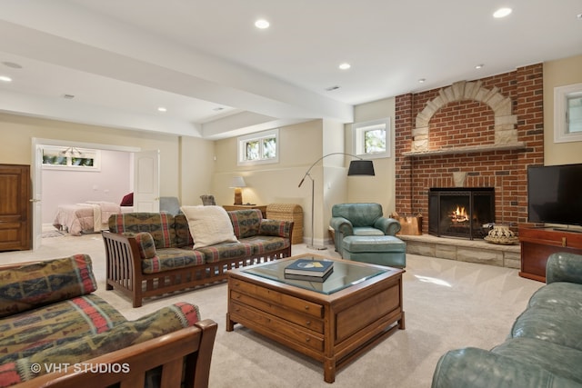 living room with a fireplace and light colored carpet