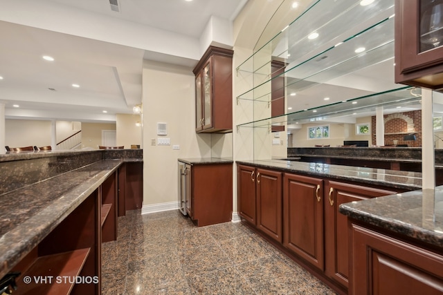 bar with dark stone countertops