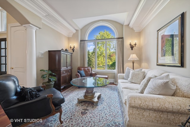 living room featuring hardwood / wood-style flooring, ornamental molding, and ornate columns