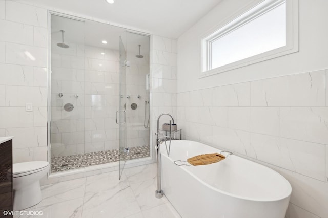 full bathroom featuring plus walk in shower, vanity, toilet, and tile walls