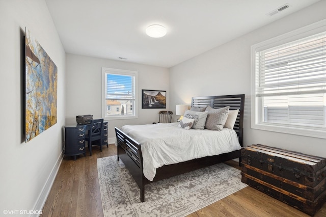 bedroom with hardwood / wood-style floors