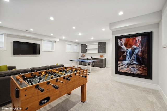 game room featuring light colored carpet