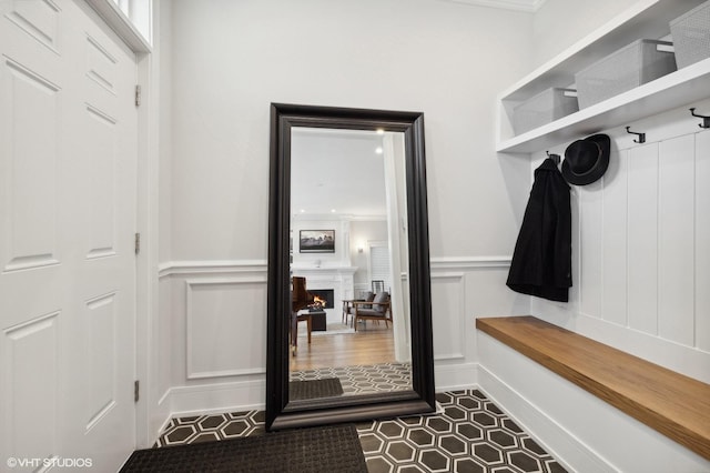 mudroom featuring crown molding