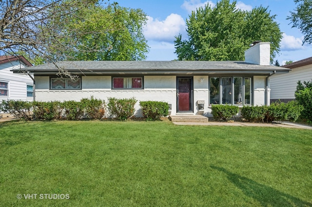 ranch-style home with a front lawn