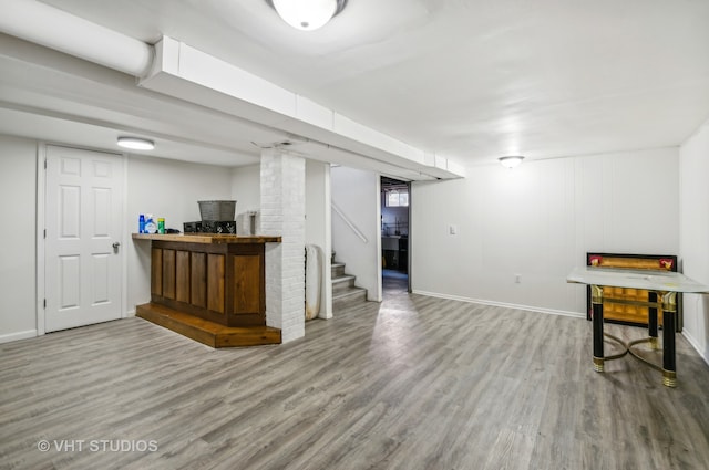 basement with hardwood / wood-style flooring