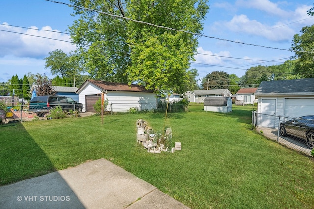 view of yard with an outbuilding and a garage