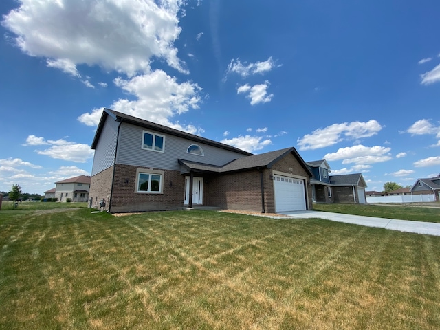 view of front facade with a front yard and a garage