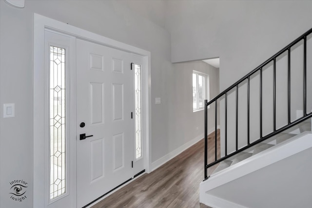 foyer entrance featuring dark wood-type flooring