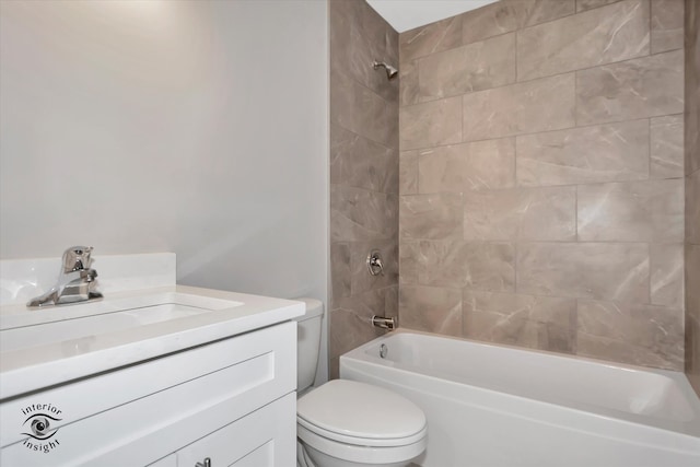 full bathroom with tiled shower / bath combo, toilet, and vanity