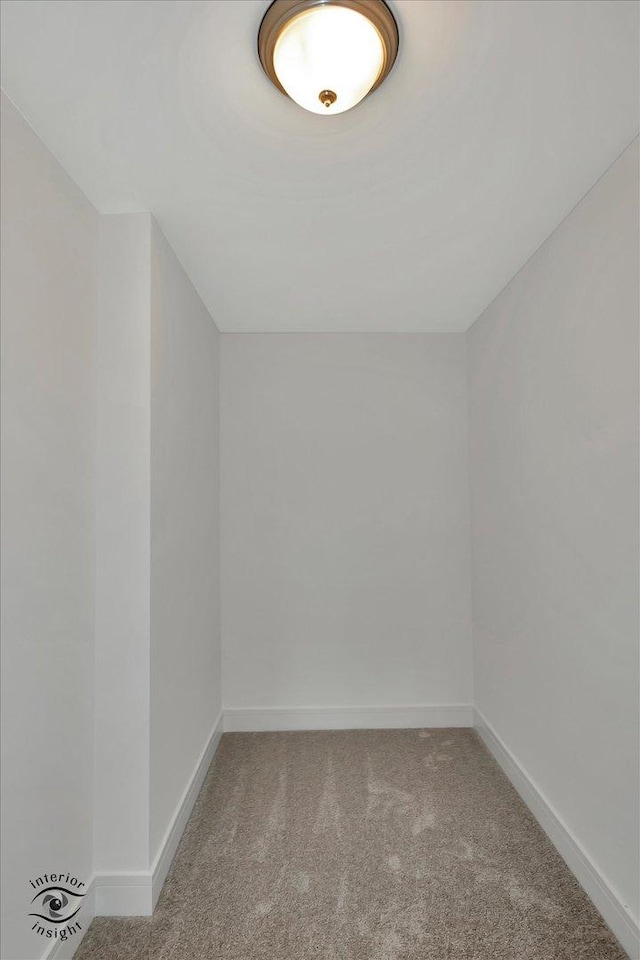 bonus room featuring carpet flooring and baseboards