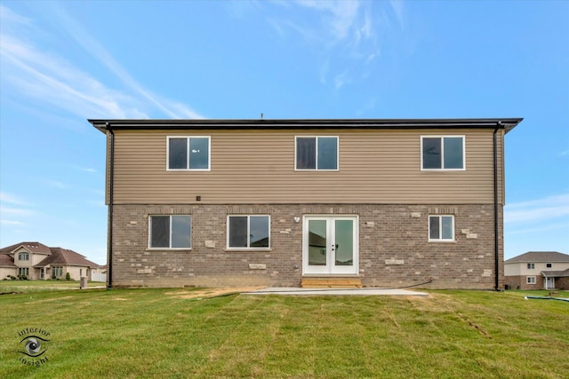 back of house with a lawn and a patio area