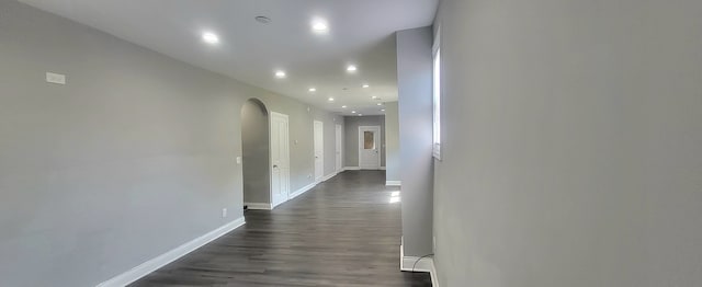 empty room with dark hardwood / wood-style flooring