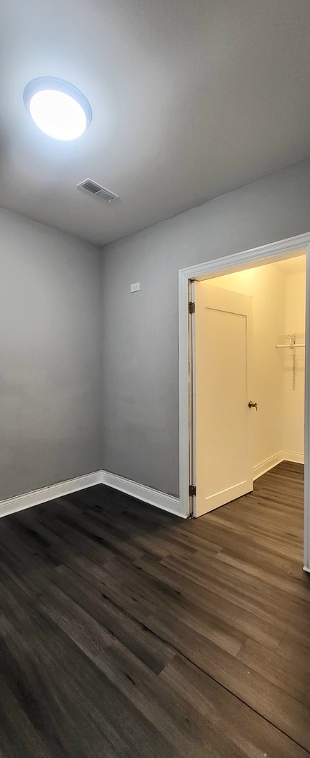 bedroom with wood-type flooring