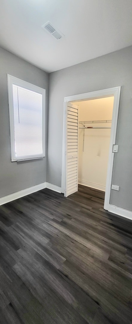 bedroom with hardwood / wood-style flooring