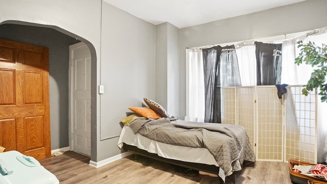 bedroom with wood-type flooring