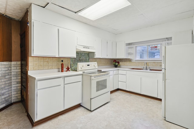 kitchen with light tile patterned flooring, backsplash, custom exhaust hood, and white appliances