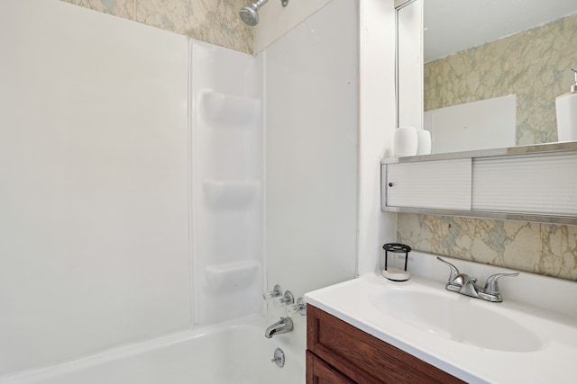 bathroom featuring vanity and tub / shower combination