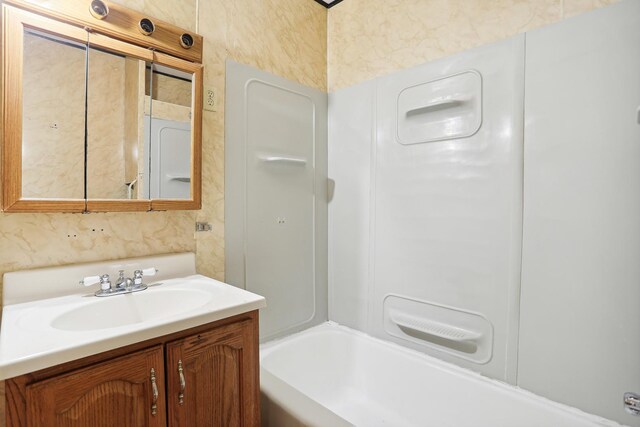 bathroom featuring vanity and bathtub / shower combination