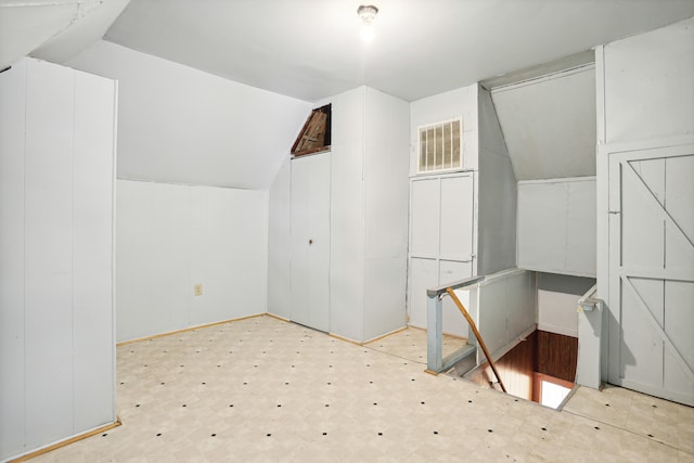 bonus room featuring vaulted ceiling