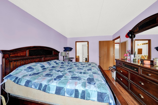 bedroom with wood-type flooring