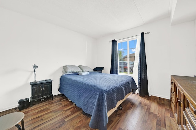 bedroom featuring dark hardwood / wood-style floors