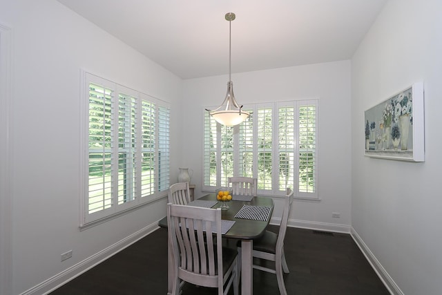 dining area featuring dark hardwood / wood-style flooring