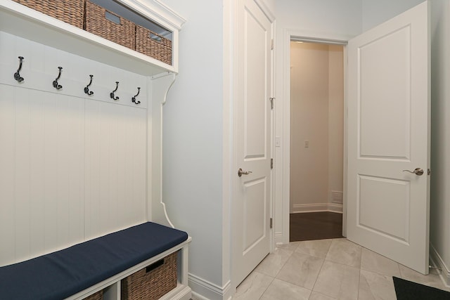 mudroom with light tile patterned floors