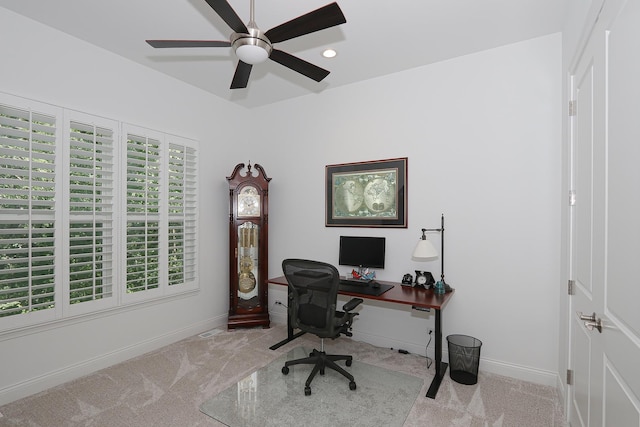 office area featuring light colored carpet and ceiling fan