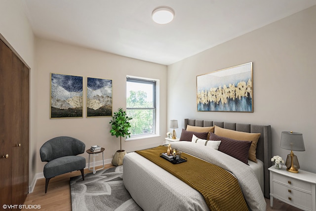 bedroom with a closet and hardwood / wood-style flooring