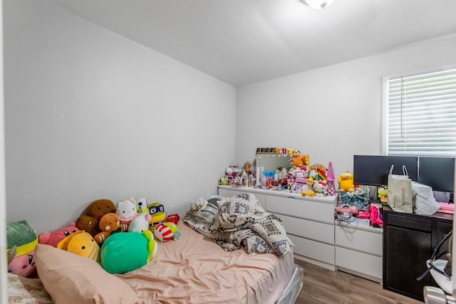 bedroom featuring light wood-style floors