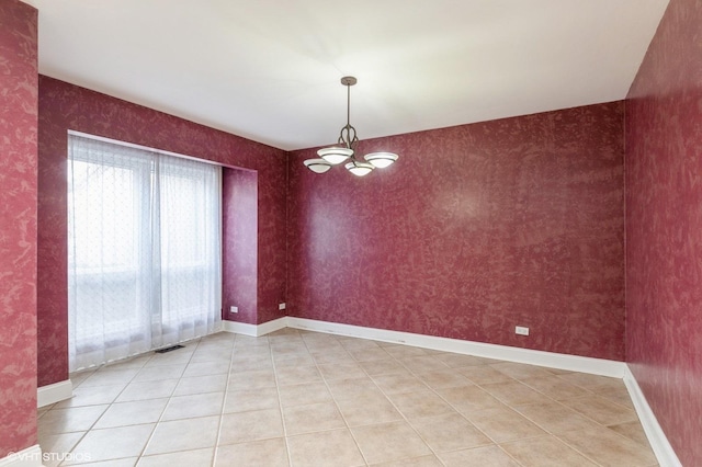 unfurnished room with light tile patterned floors