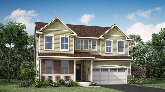 view of front of home with a garage and a front lawn