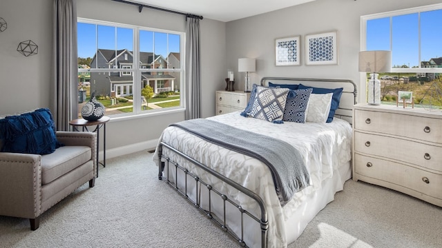 bedroom with light carpet