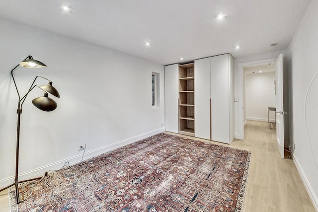 unfurnished bedroom with light wood-type flooring