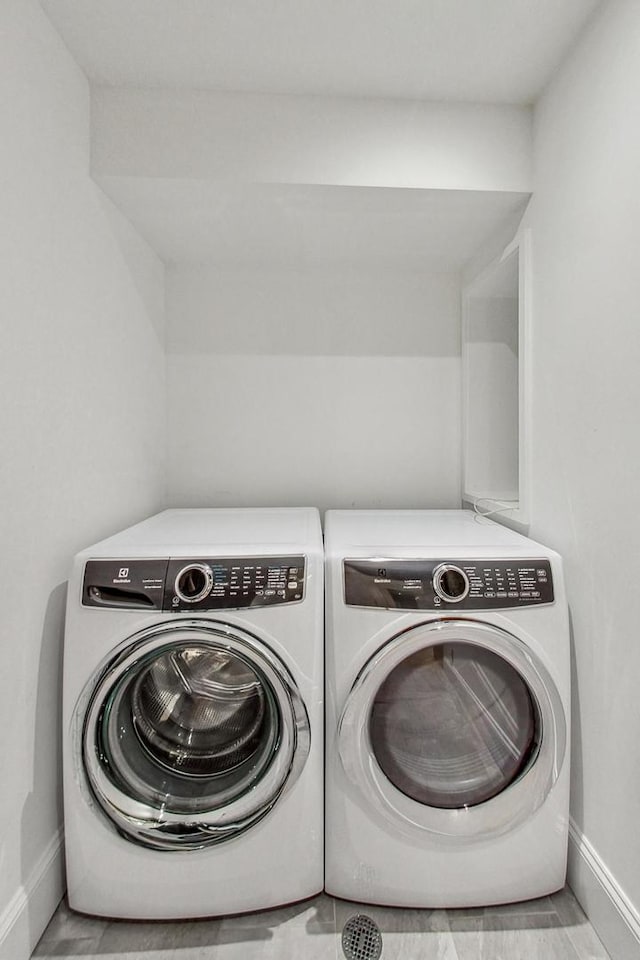 laundry area with washing machine and clothes dryer