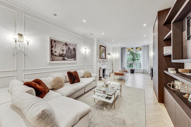 living room with ornamental molding and light tile patterned floors