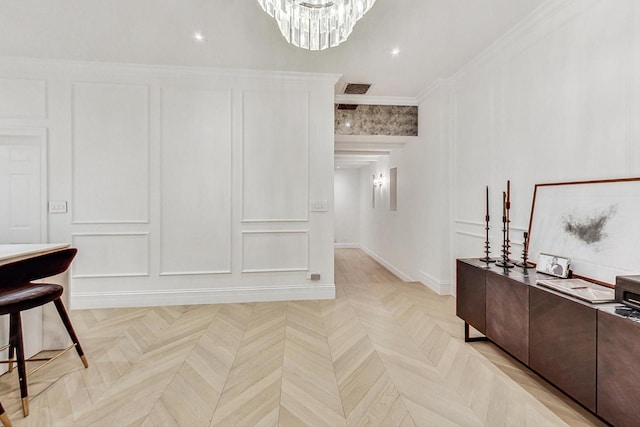 interior space with ornamental molding and light parquet flooring