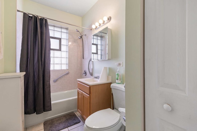 full bathroom featuring tile flooring, vanity, toilet, and shower / tub combo