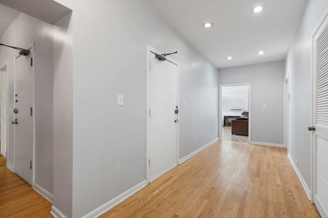 corridor with light wood-type flooring