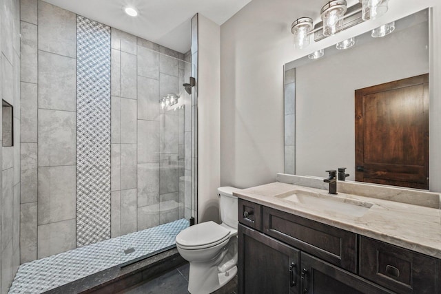 bathroom with vanity, toilet, and walk in shower